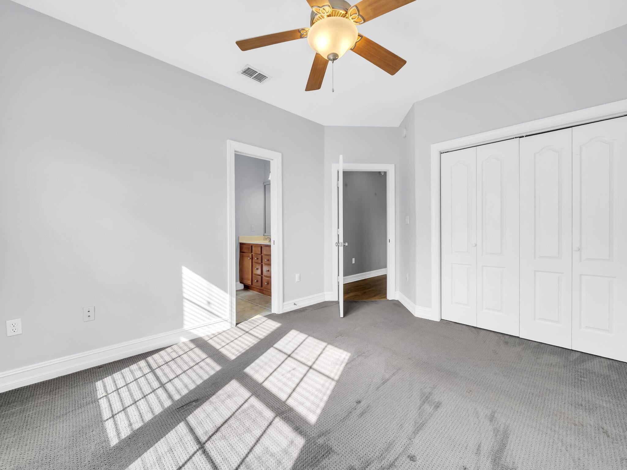 180 Gulf Pines Court Freeport, FL 32439 - Photo 47 of 70 a view of an empty room with window and wooden floor