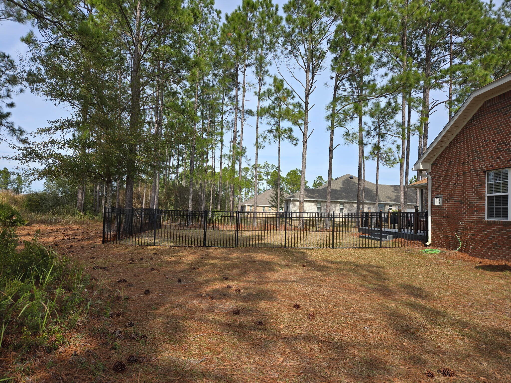 180 Gulf Pines Court Freeport, FL 32439 - Photo 62 of 70 a view of backyard with swimming pool and seating space