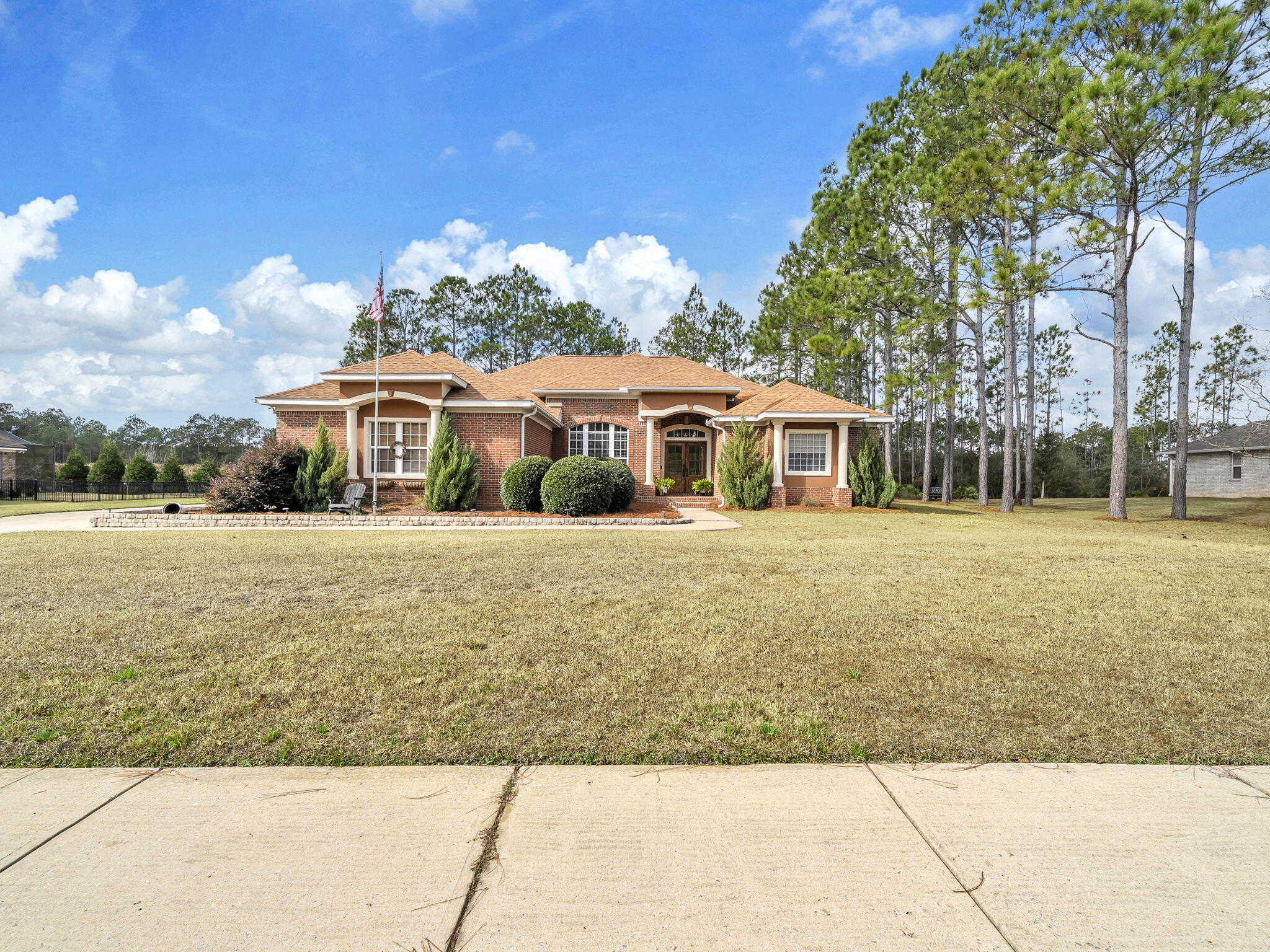 180 Gulf Pines Court Freeport, FL 32439 - Photo 7 of 70 a front view of a house with a yard