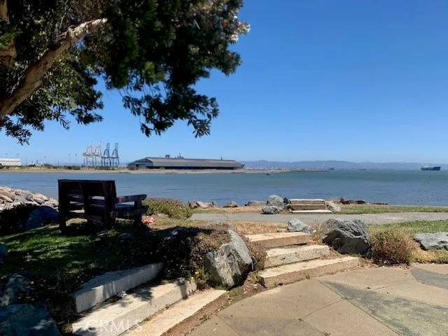 a view of a terrace with lawn chairs