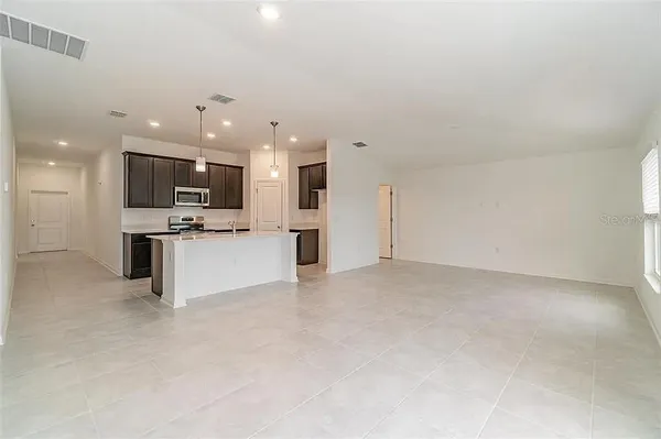 a view of kitchen and kitchen with a sink