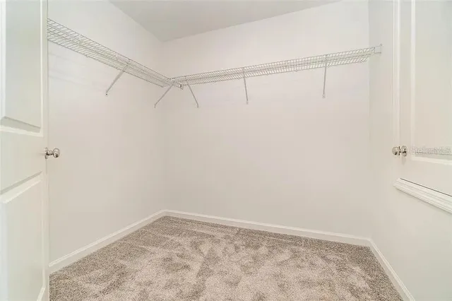 a view of an empty walk in closet