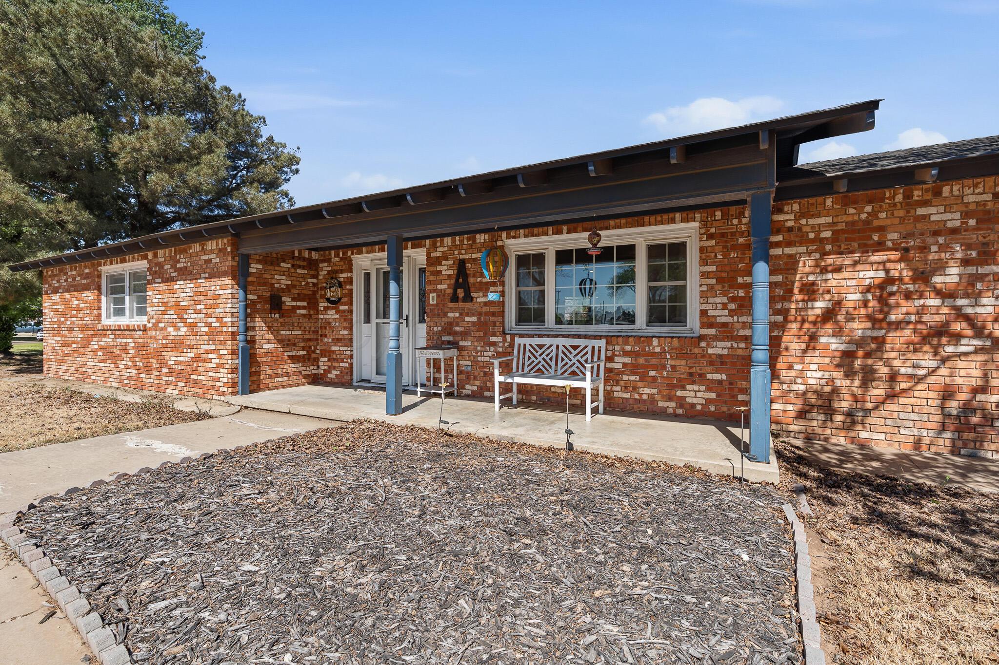 700 West Cleveland Street Dimmitt, TX 79027 - Photo 2 of 40 a view of a house with backyard and sitting area