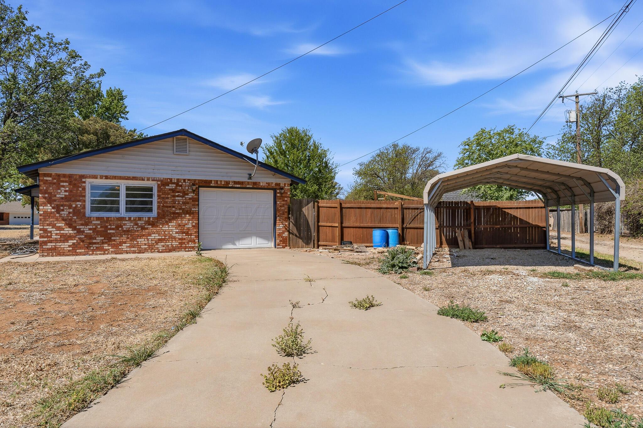 700 West Cleveland Street Dimmitt, TX 79027 - Photo 32 of 40 a front view of a house with a yard