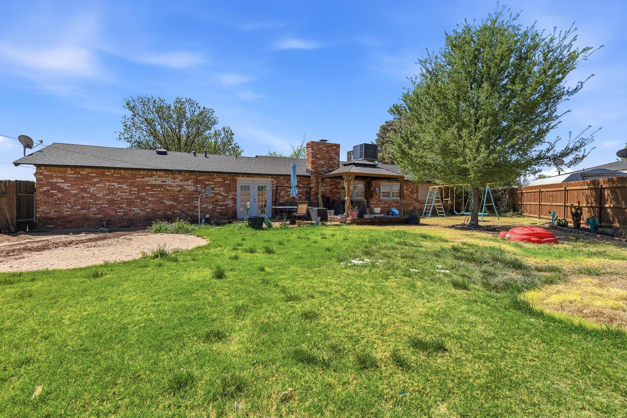 700 West Cleveland Street Dimmitt, TX 79027 - Photo 33 of 40 a view of a house with a big yard