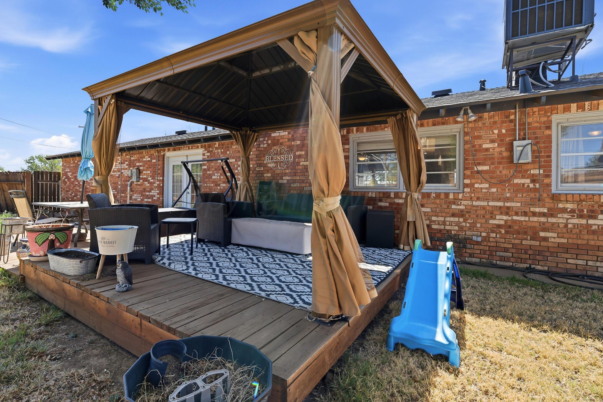 700 West Cleveland Street Dimmitt, TX 79027 - Photo 36 of 40 a view of deck with patio