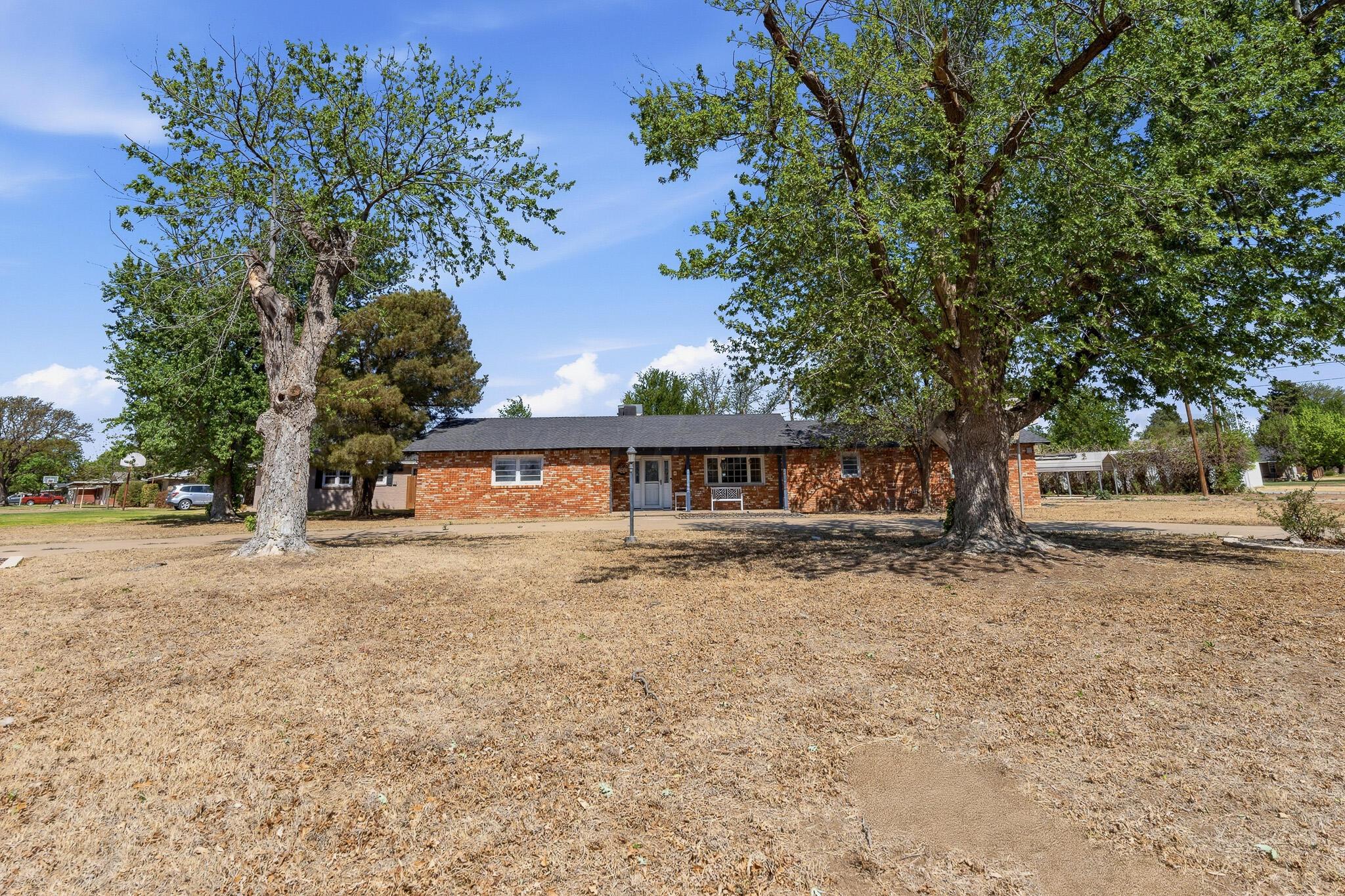 700 West Cleveland Street Dimmitt, TX 79027 - Photo 38 of 40 a view of a house with a yard