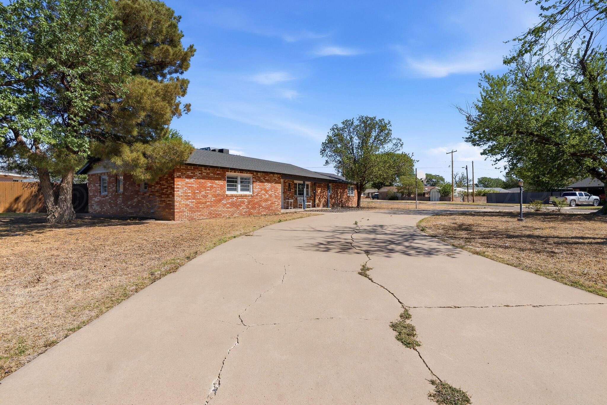 700 West Cleveland Street Dimmitt, TX 79027 - Photo 40 of 40 a house with trees in front of it