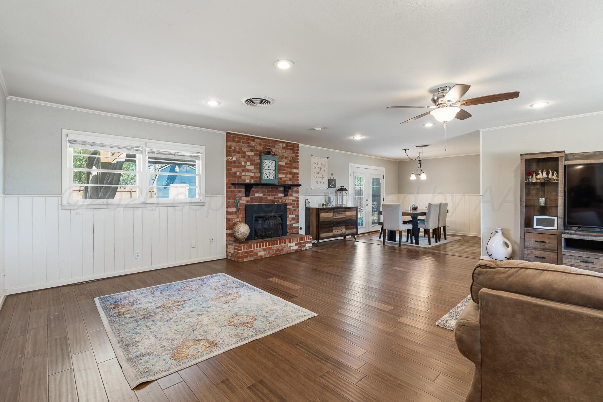 700 West Cleveland Street Dimmitt, TX 79027 - Photo 8 of 40 a living room with furniture and a wooden floor