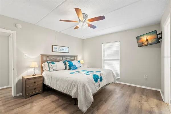 a bedroom with bed and a window