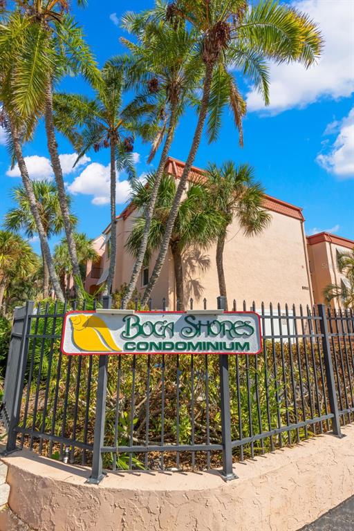 8911 Blind Pass Road, Unit 214 St. Pete Beach, FL 33706 - Photo 2 of 35 a view of a swimming pool with a terrace