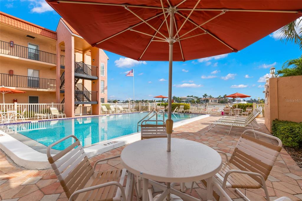 8911 Blind Pass Road, Unit 214 St. Pete Beach, FL 33706 - Photo 23 of 35 a outdoor view with a sitting space