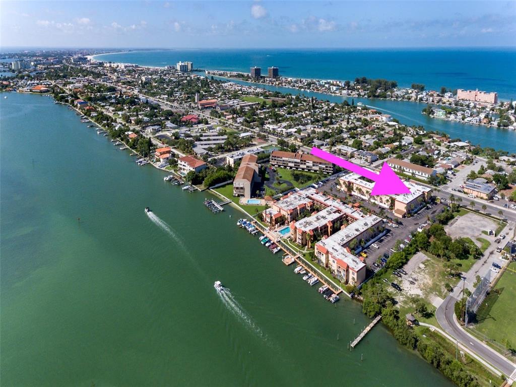 8911 Blind Pass Road, Unit 214 St. Pete Beach, FL 33706 - Photo 32 of 35 an aerial view of multiple house