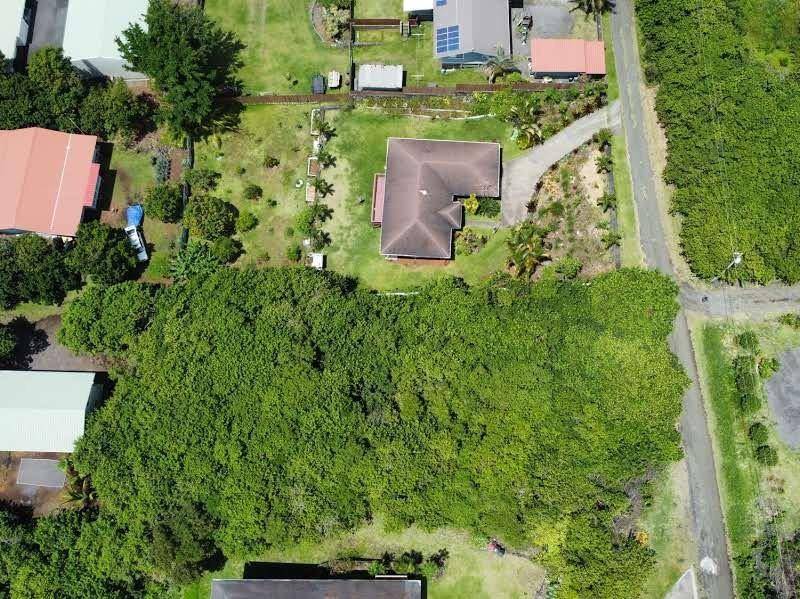 5 Kuamo'o Road Naalehu, HI 96772 - Photo 4 of 6 an aerial view of a house with a yard
