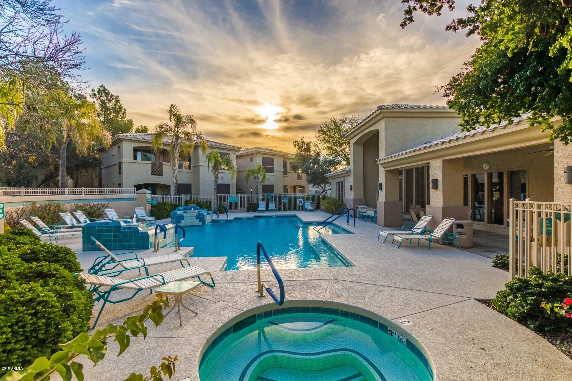 9550 East Thunderbird Road, Unit 252 Scottsdale, AZ 85260 - Photo 18 of 21 a swimming pool with outdoor seating and yard