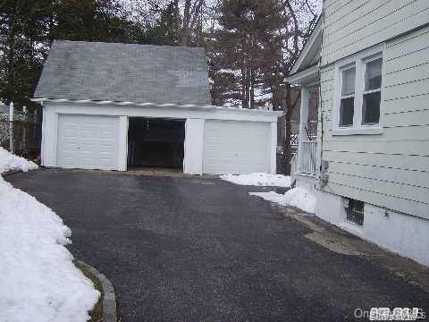 267 Schenck Avenue, Unit # RIGHT Great Neck, NY 11021 - Photo 8 of 8 View of snow covered garage
