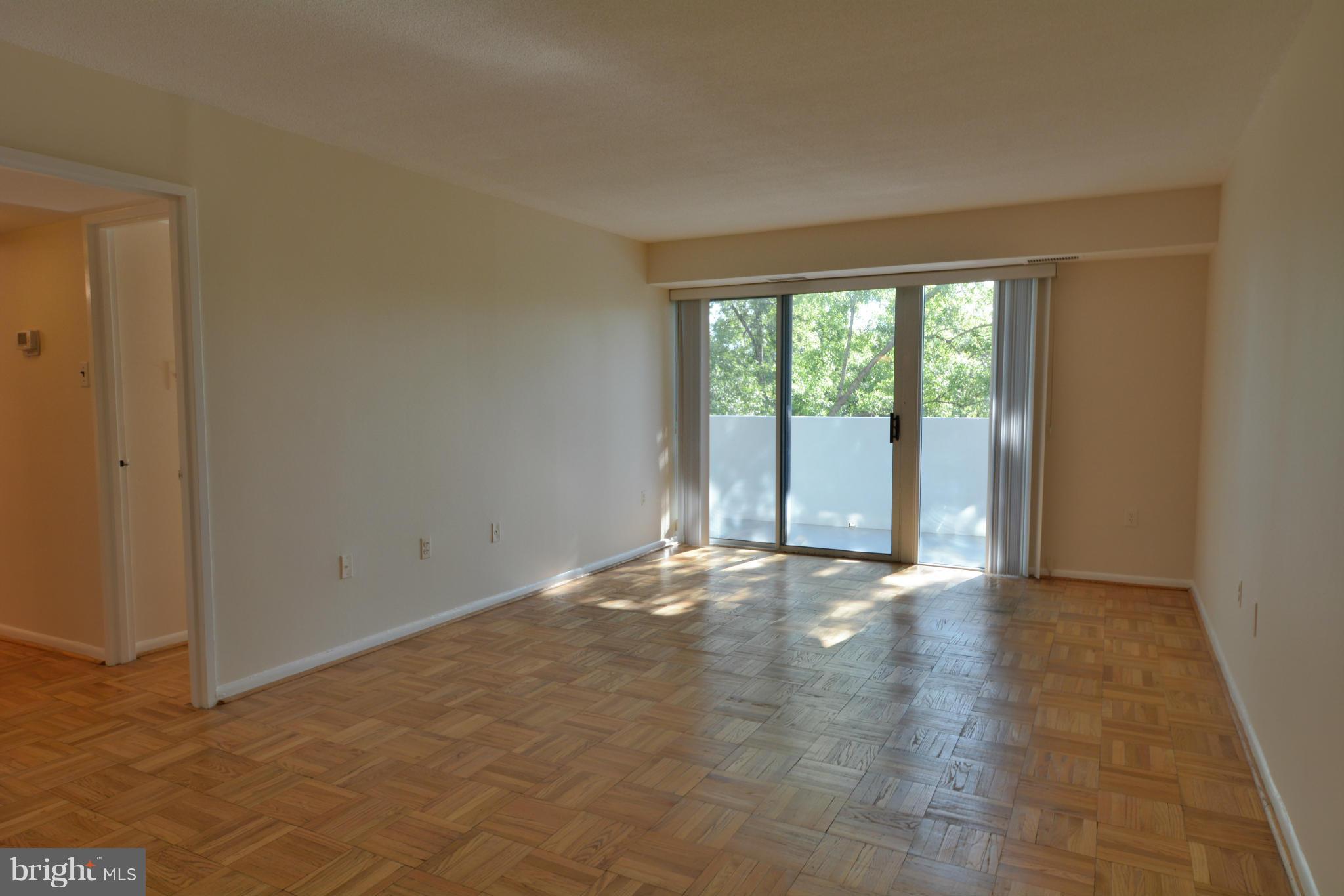 700 7th Street Southwest, Unit 630 Washington, DC 20024 - Photo 2 of 28 an empty room with large windows