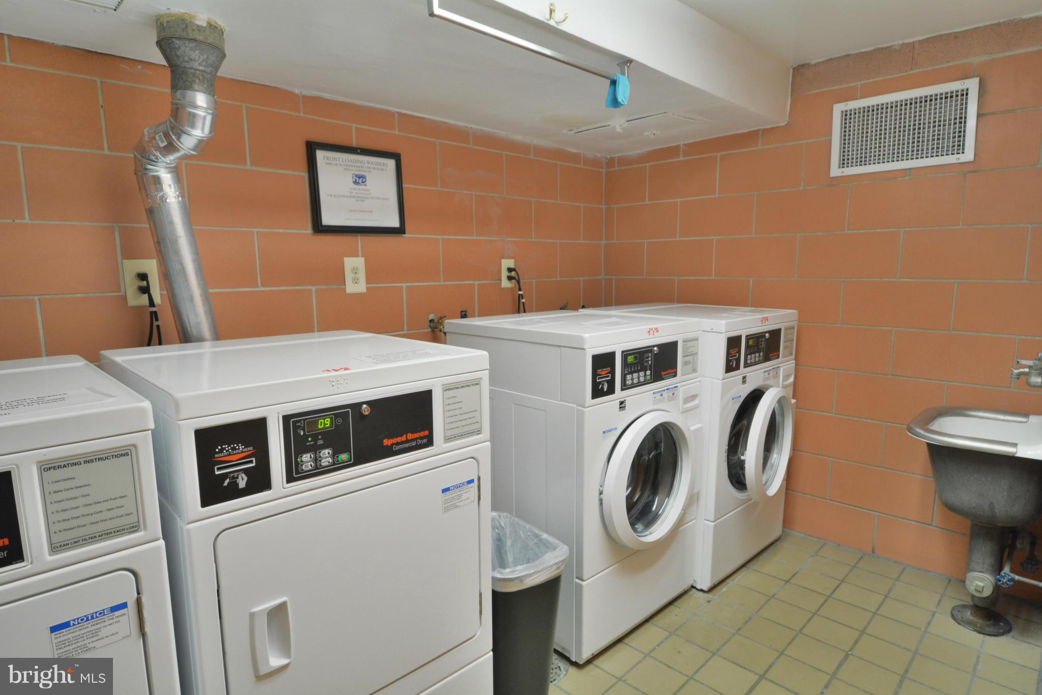 700 7th Street Southwest, Unit 630 Washington, DC 20024 - Photo 22 of 28 a utility room with dryer and washer