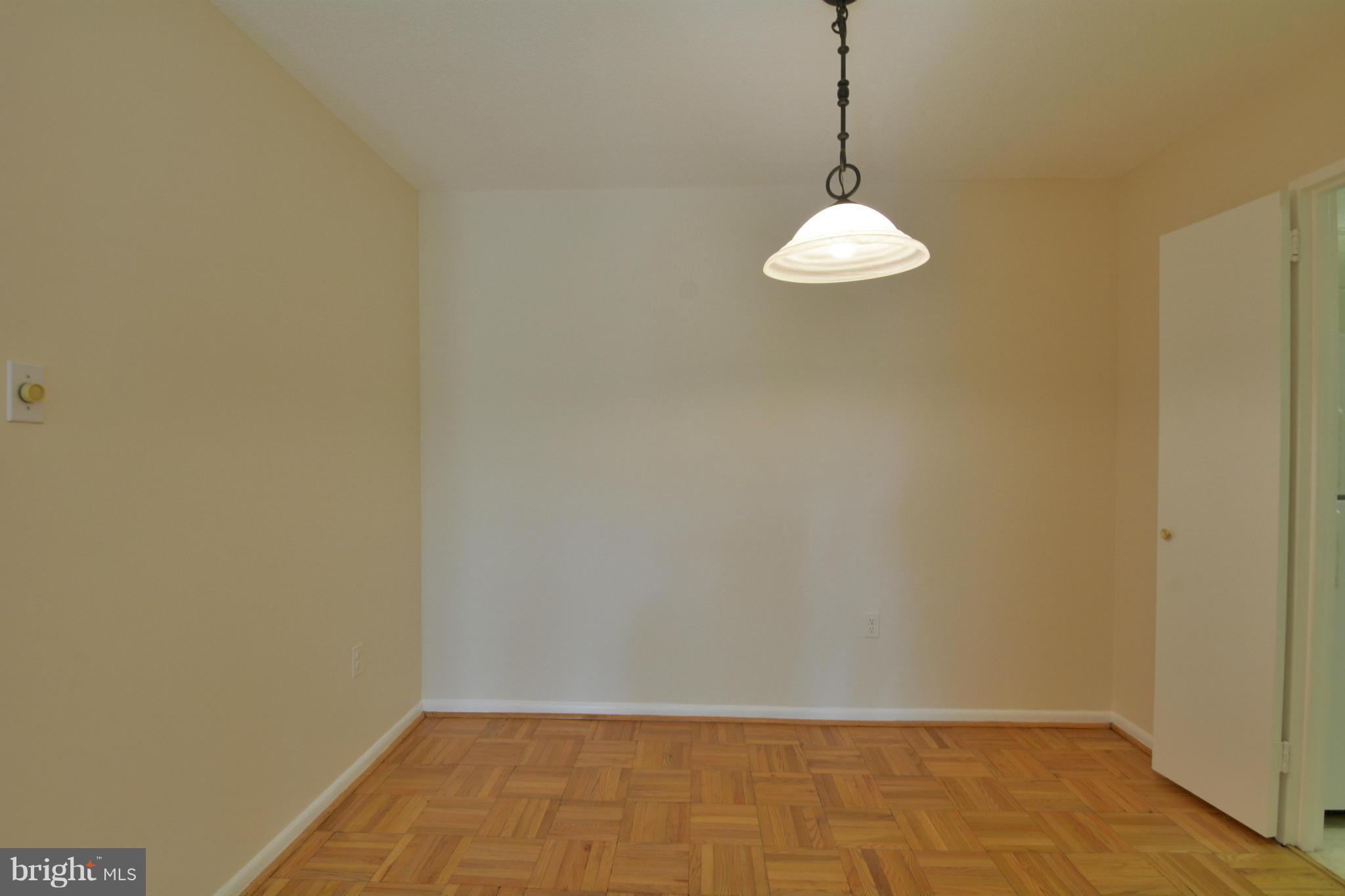 700 7th Street Southwest, Unit 630 Washington, DC 20024 - Photo 7 of 28 a room with a table and a chair