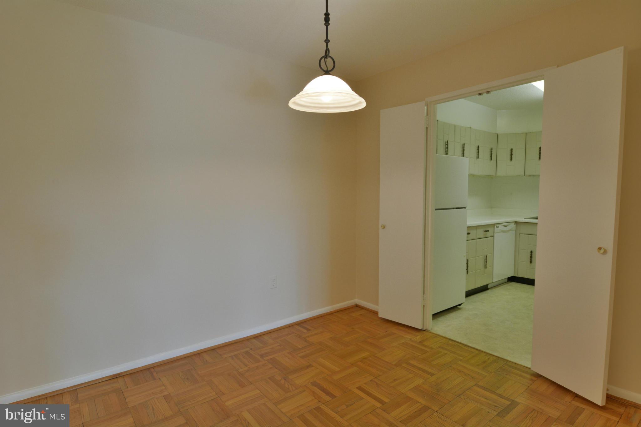 700 7th Street Southwest, Unit 630 Washington, DC 20024 - Photo 9 of 28 a view of a room with a stylish ceiling fan and chandelier