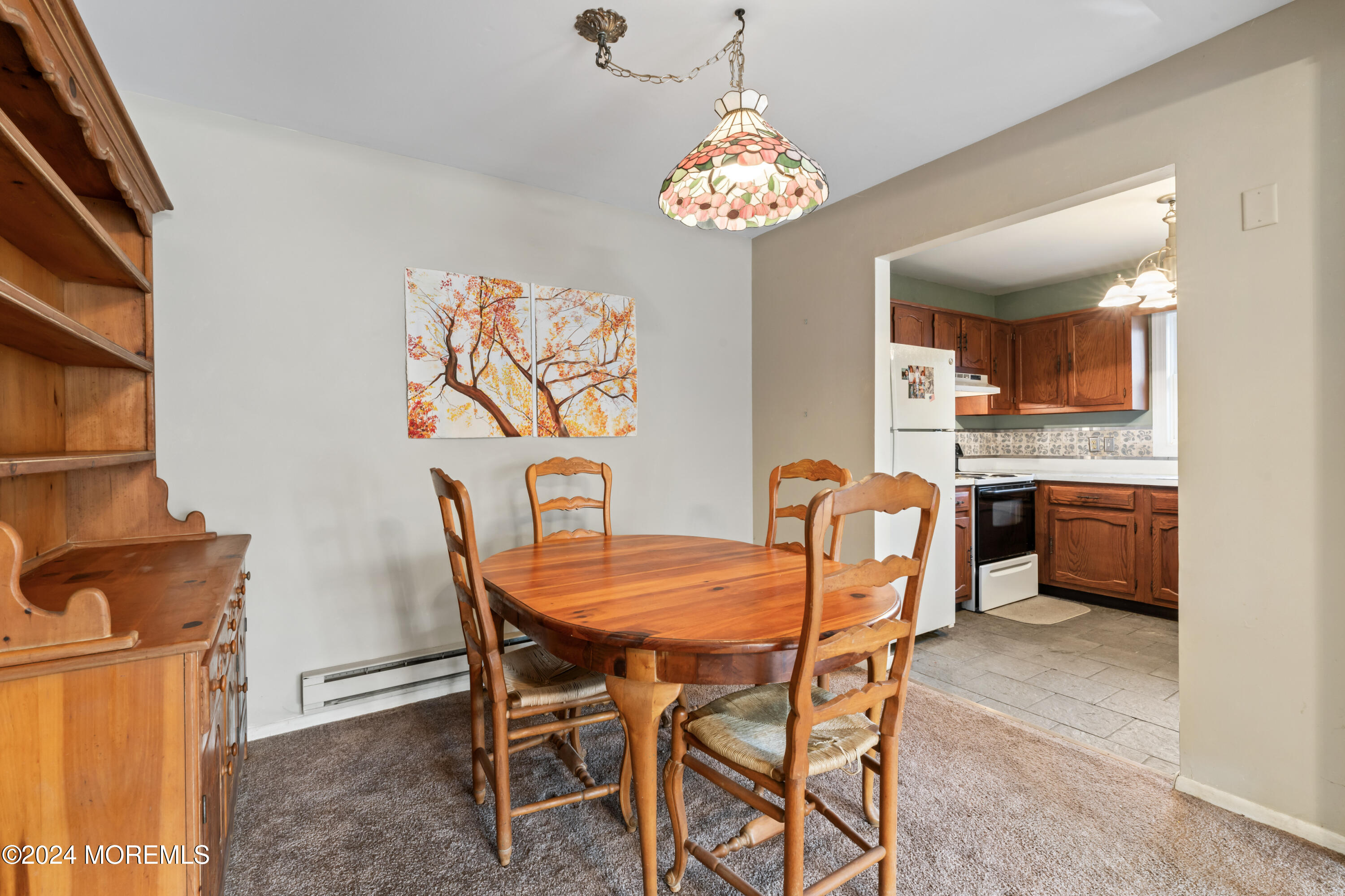 34 Cranberry Road Manahawkin, NJ 08050 - Photo 7 of 17 a dining room with furniture and chandelier