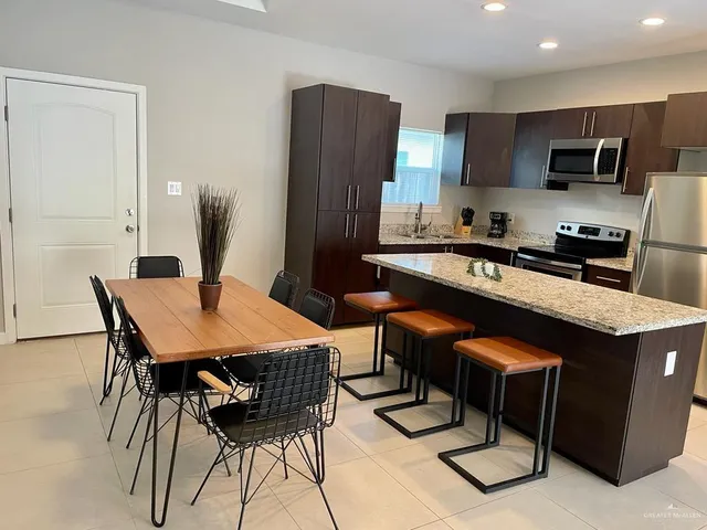 a table and chairs in a kitchen
