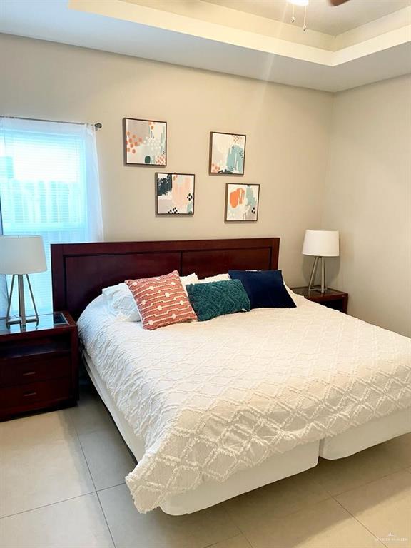 3007 Javalina Avenue, Unit 4 Edinburg, TX 78542 - Photo 9 of 16 a bedroom with a bed and painting on the wall