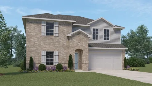 a front view of a house with a yard and trees