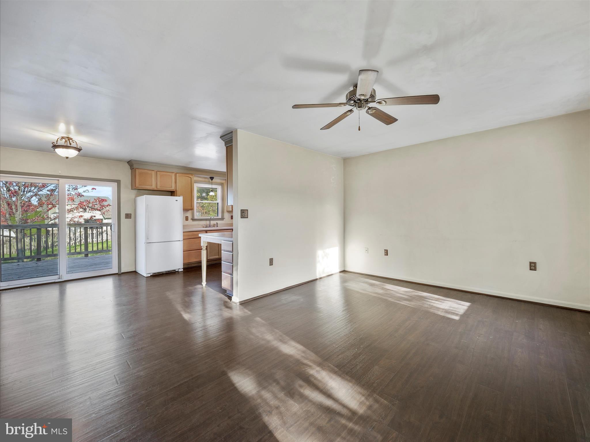 104 Rebecca's Court Smithsburg, MD 21783 - Photo 13 of 34 an empty room with wooden floor ceiling fan and windows