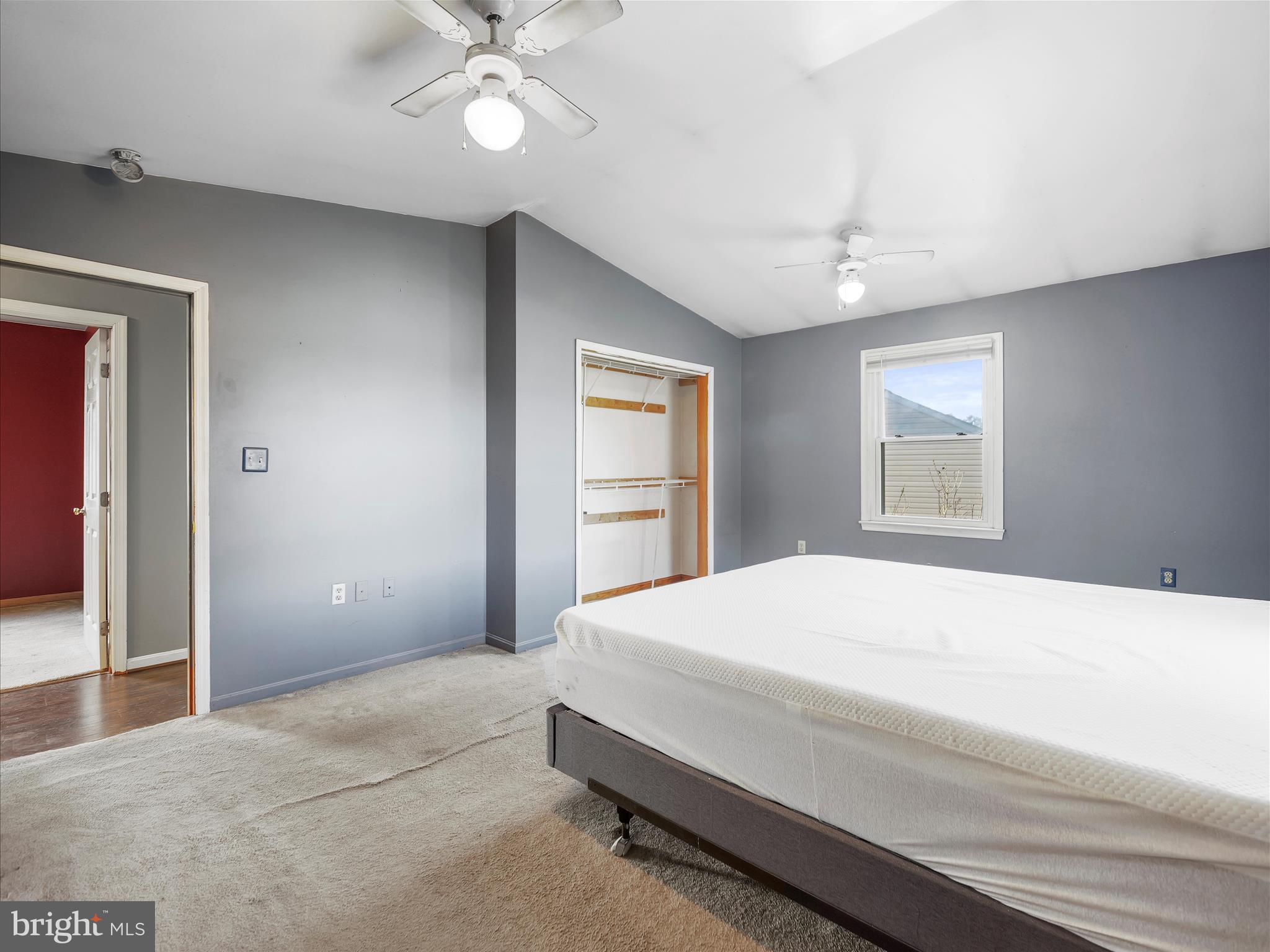 104 Rebecca's Court Smithsburg, MD 21783 - Photo 16 of 34 a bedroom with a large bed and a chandelier