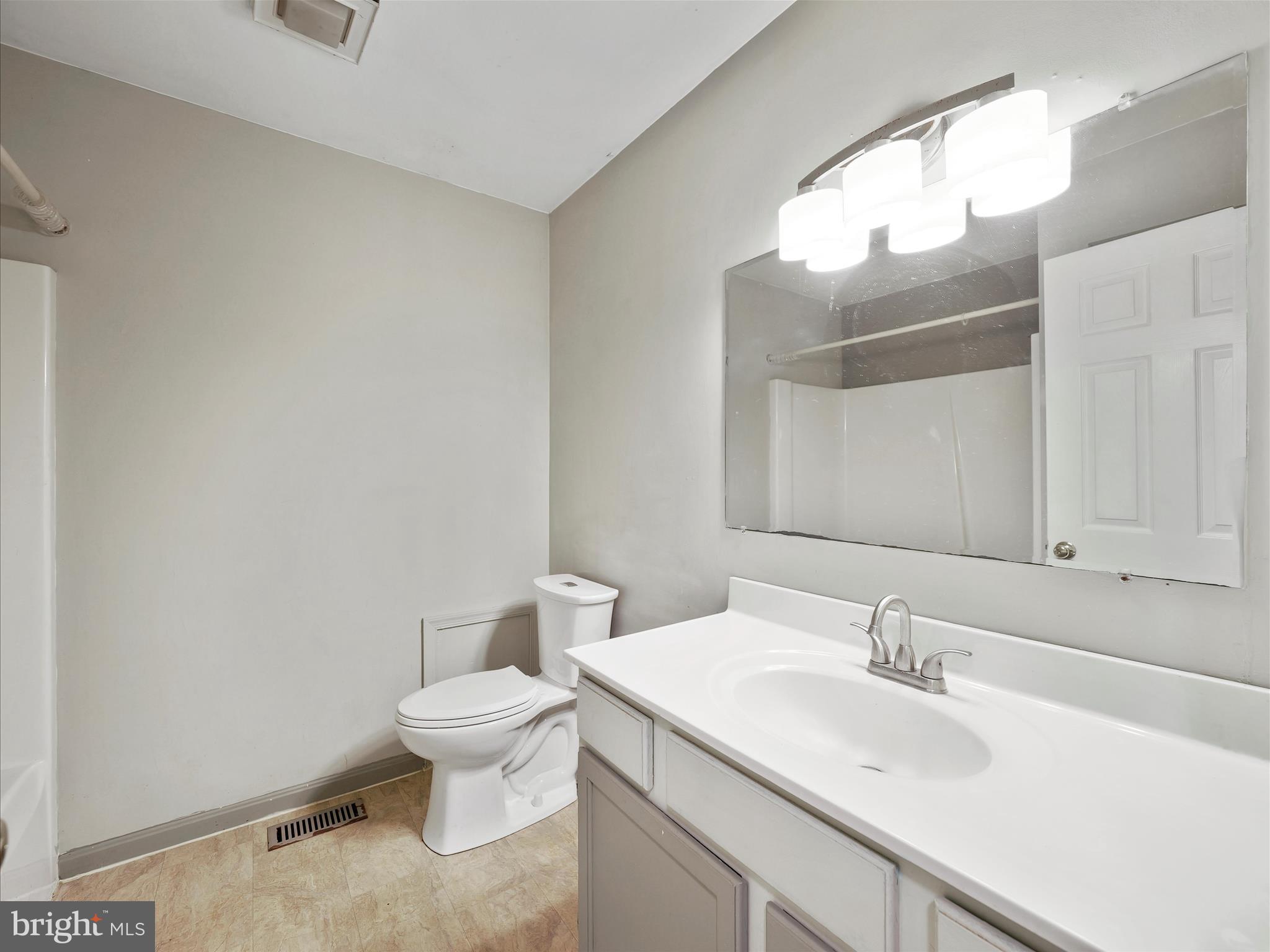 104 Rebecca's Court Smithsburg, MD 21783 - Photo 20 of 34 a bathroom with a sink a toilet and mirror