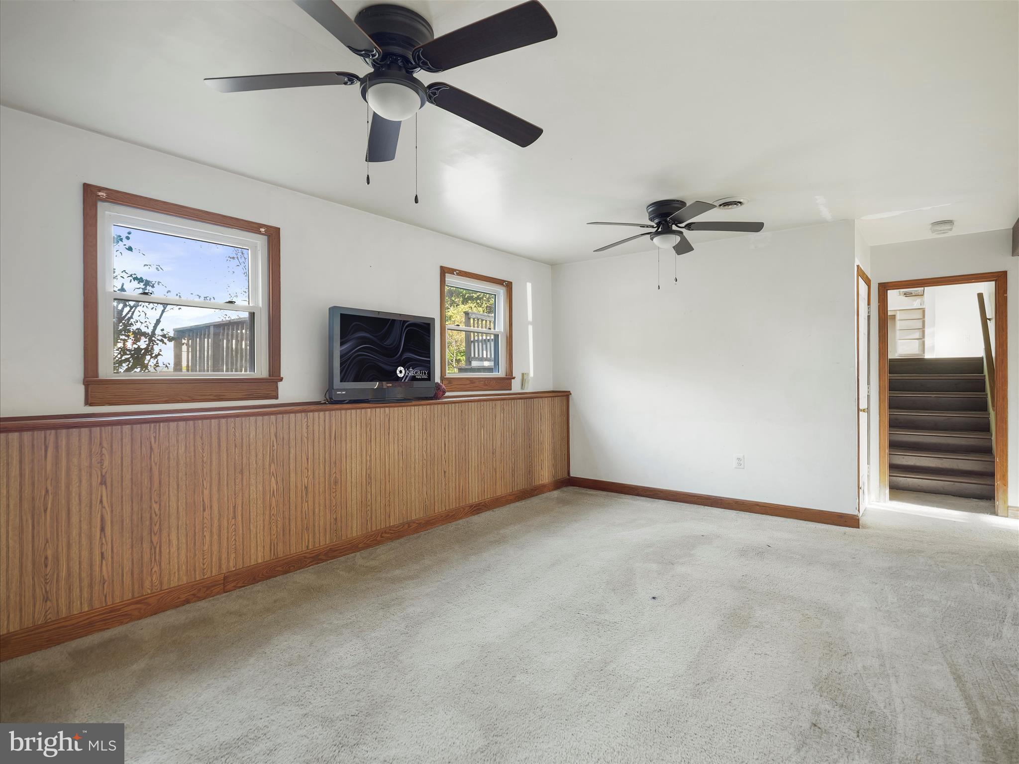 104 Rebecca's Court Smithsburg, MD 21783 - Photo 23 of 34 a view of an empty room with a ceiling fan and a window