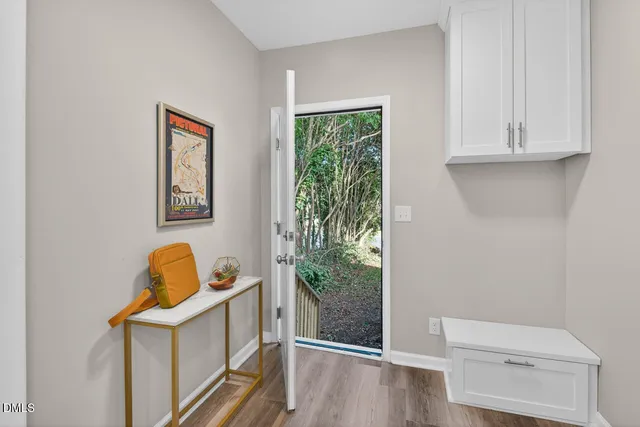a view of a dining room with a table and chairs