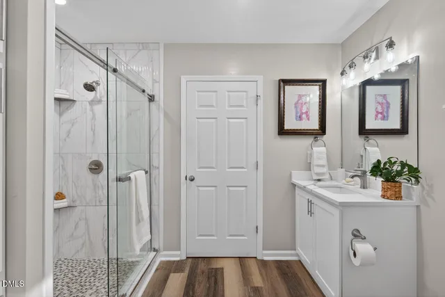 a bathroom with a shower and a toilet