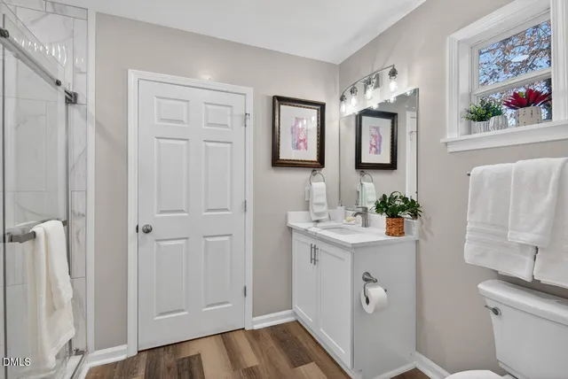 a bathroom with a shower and a shower