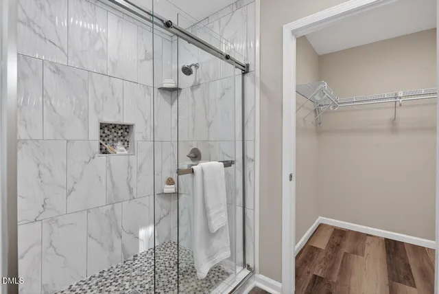 a view of a livingroom with furniture and a window
