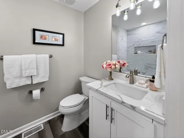 a bedroom with bed and a window