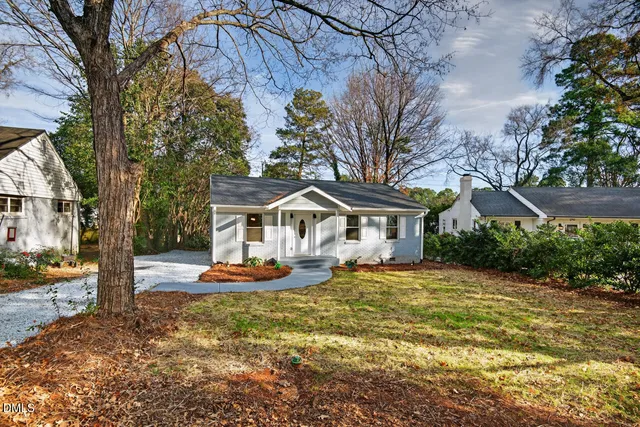 a view of a chair and table in the backyard