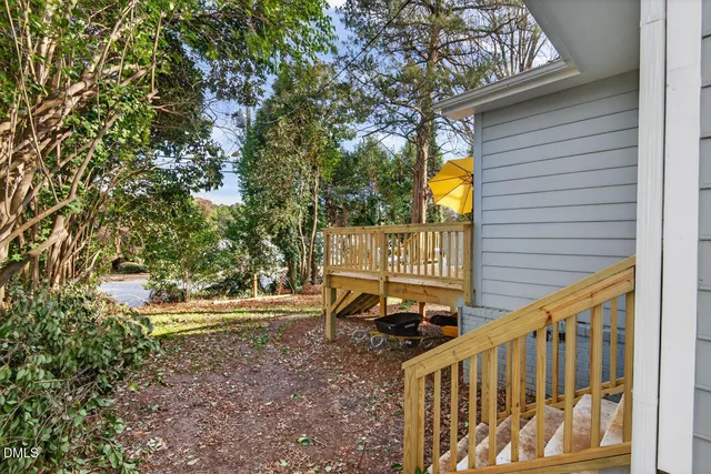 a view of a house with a small deck
