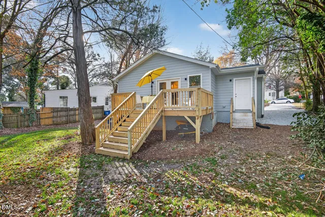 a view of balcony with table and chairs