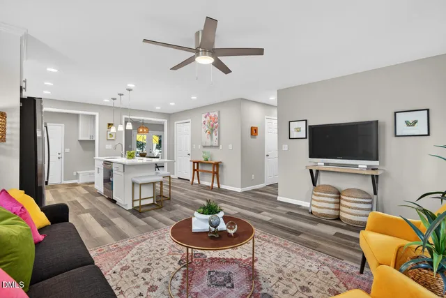a living room with furniture and a flat screen tv