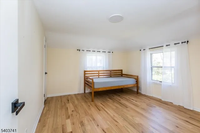 a room with a bed and a window