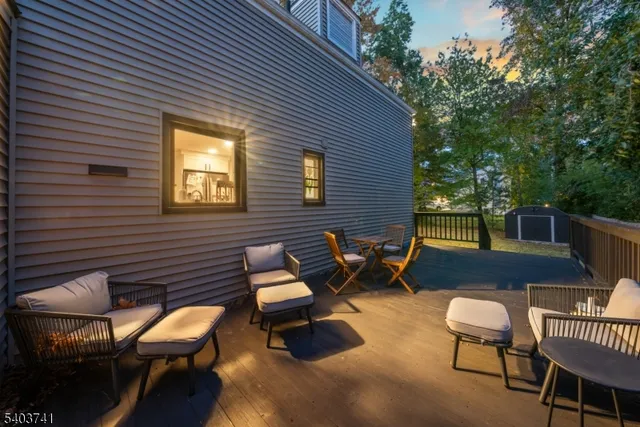 a view of a backyard with chairs and a patio