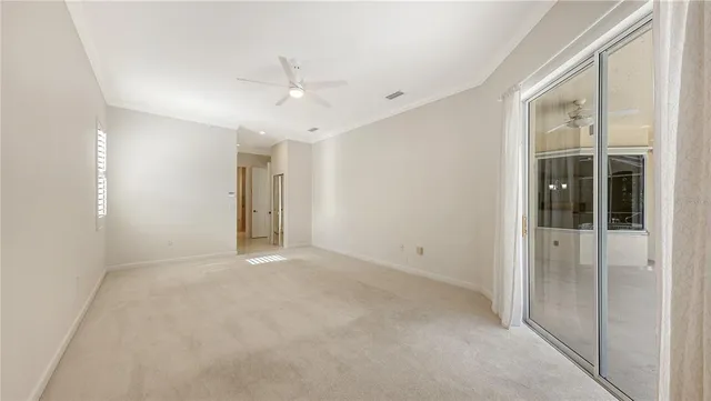 a view of an empty room with a bathroom