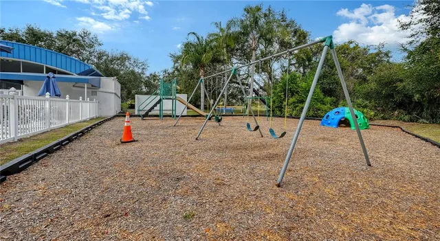 a view of park with swings