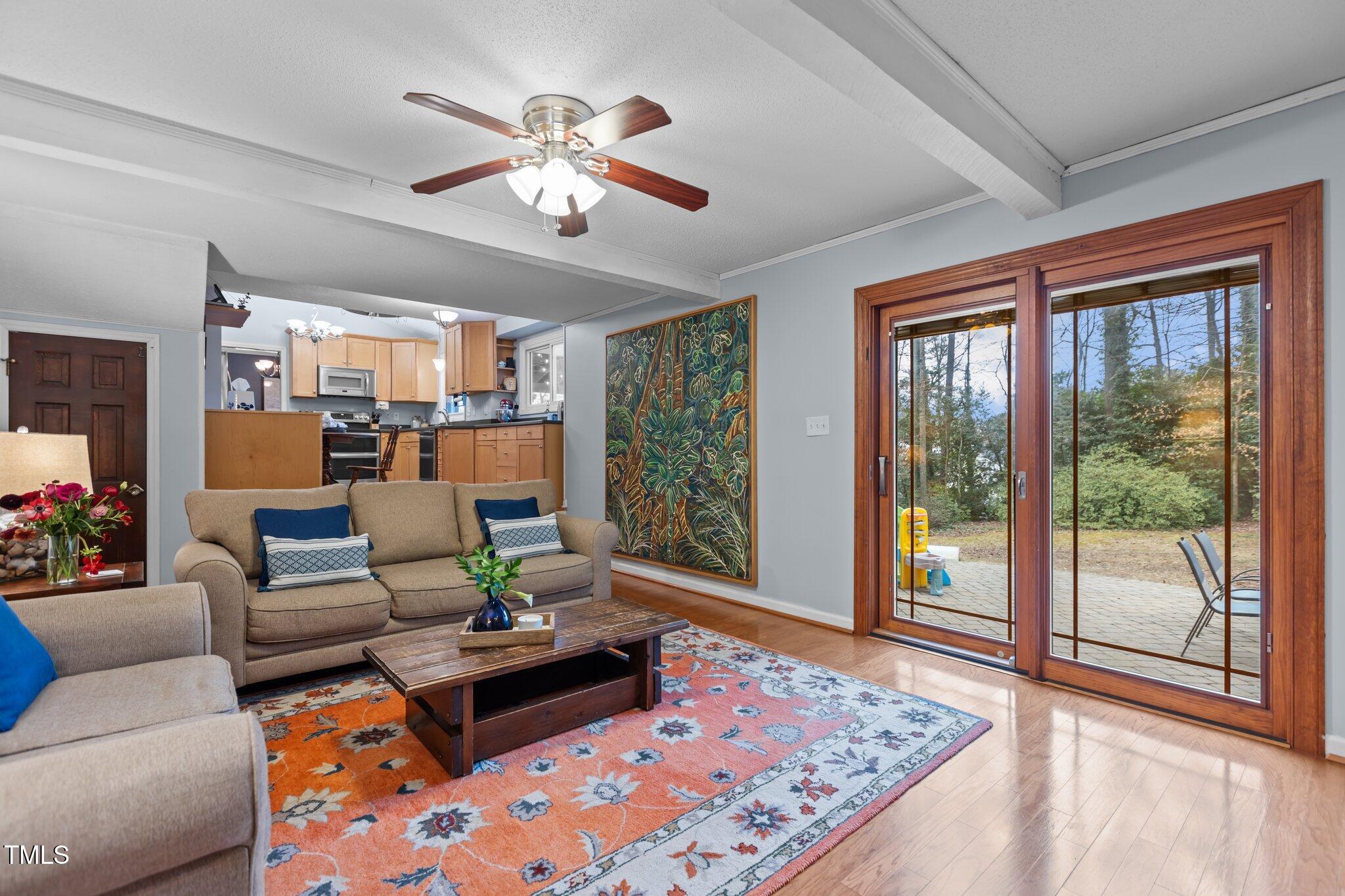 7612 Harps Mill Road Raleigh, NC 27615 - Photo 19 of 49 a living room with furniture and a large window