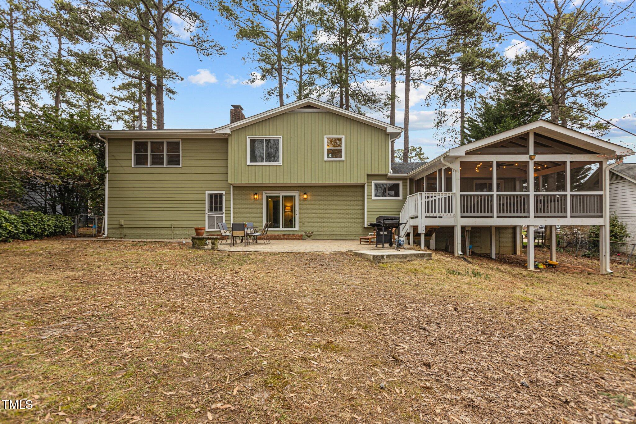 7612 Harps Mill Road Raleigh, NC 27615 - Photo 38 of 49 a view of a house with a yard