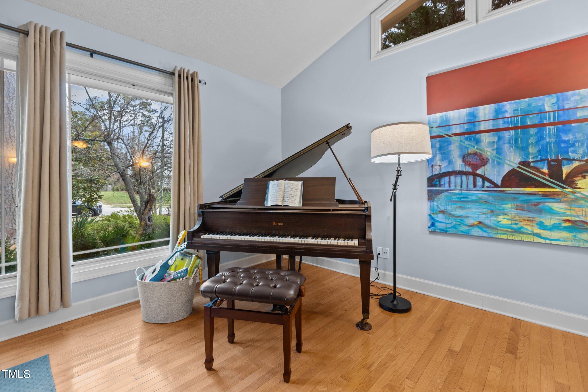 7612 Harps Mill Road Raleigh, NC 27615 - Photo 7 of 49 a living room with furniture and a window
