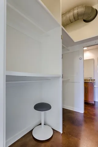 a kitchen with a refrigerator and a table