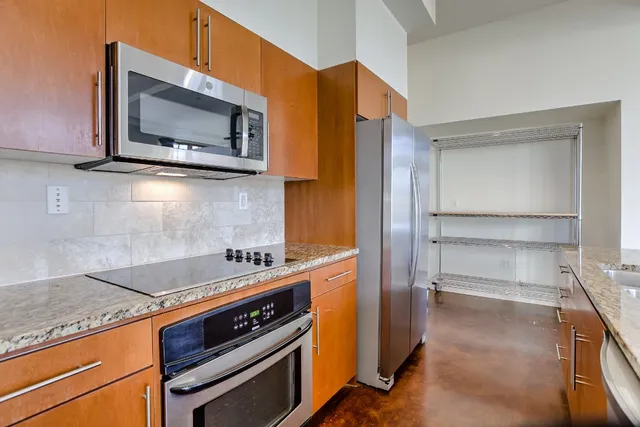 a kitchen with a stove and a microwave